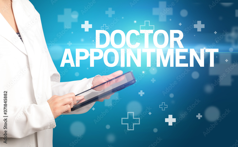 doctor writes notes on the clipboard with DOCTOR APPOINTMENT inscription, first aid concept doctor writes notes on the clipboard with DOCTOR APPOINTMENT inscription, first aid concept