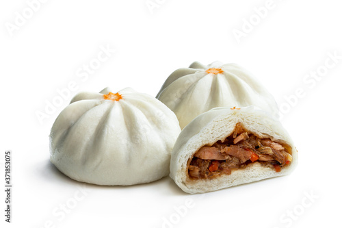 Steamed bao buns with delicious filling isolated on white