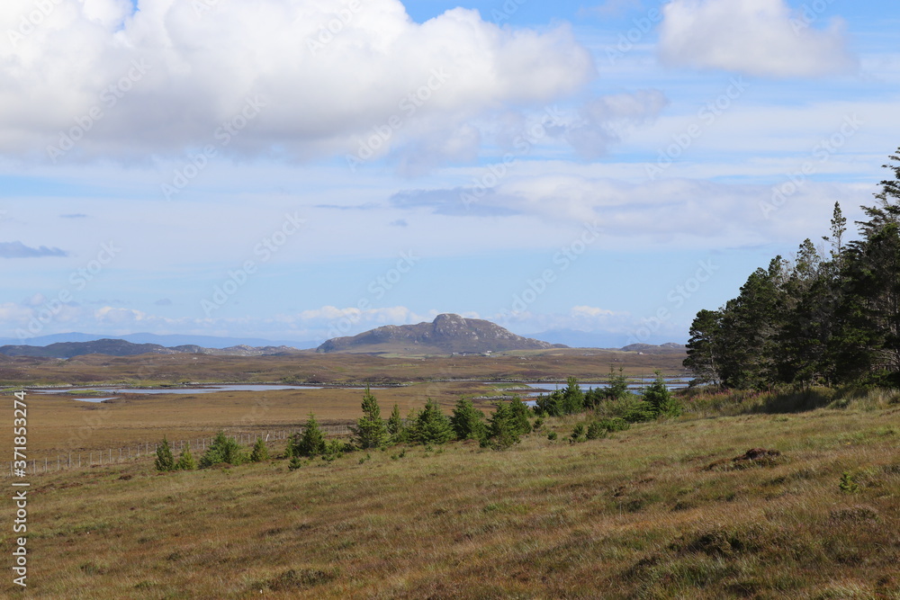 Fototapeta premium mountain landscape with blue sky and clouds, north uist, outer hebrides, scotland