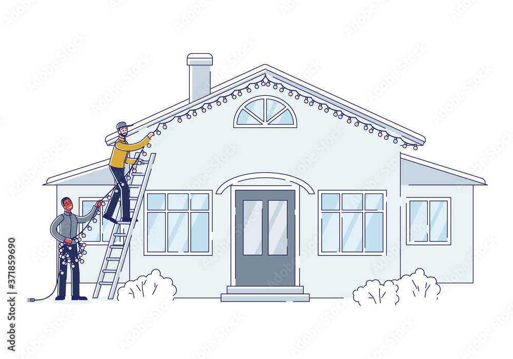 Christmas decoration outdoors. Two men putting garland lights on house building