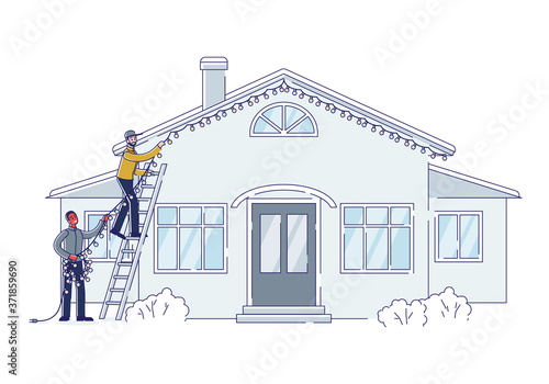 Christmas decoration outdoors. Two men putting garland lights on house building