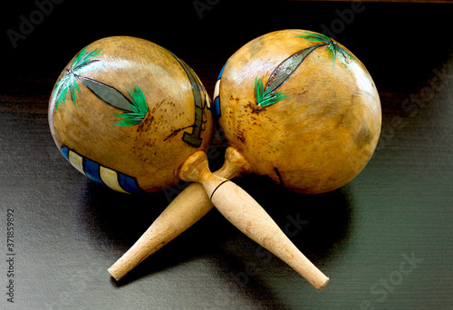 Beautiful maracas made of wood that serve as a musical instrument.  photo