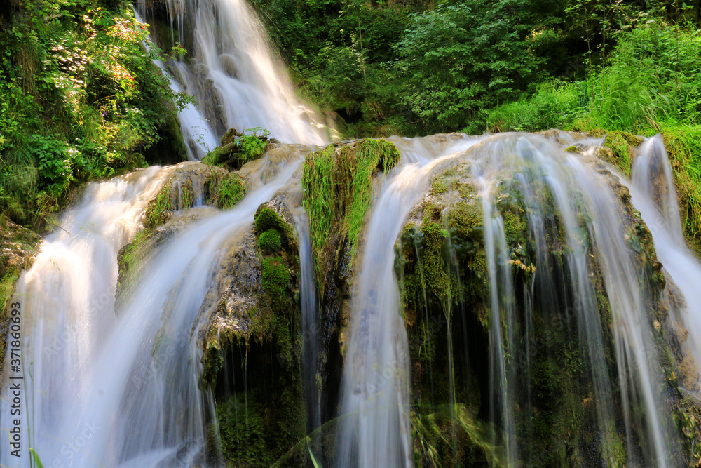 Fototapeta premium Mountain stream among the mossy stones
