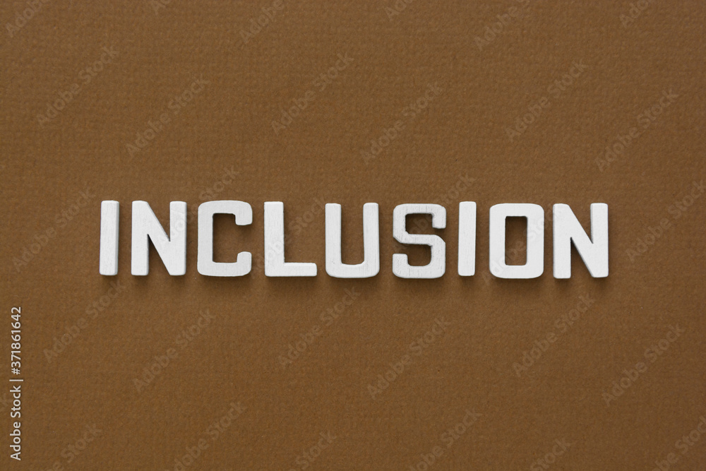Inclusion word on brown background.Equality, discrimination and integration concept. Inclusion word on brown background.Equality, discrimination and integration concept.