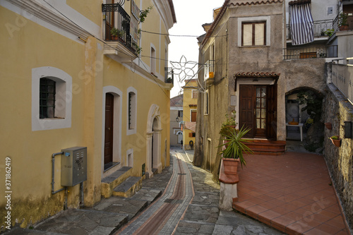 A narrow street between the old houses of San Nicola Arcella  a village in the region of Calabria  Italy.