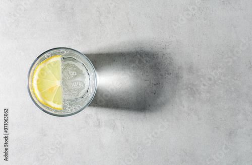 sparkling water with slice of lemon photo