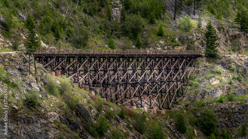 Wooden Trestle Bridge of the abandoned Kettle Valley Railway in Myra Canyon near Kelowna, British Columbia, Canada photo