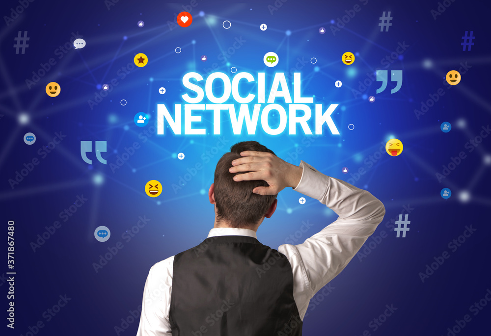 Rear view of a businessman with SOCIAL NETWORK inscription, social networking concept Rear view of a businessman with SOCIAL NETWORK inscription, social networking concept