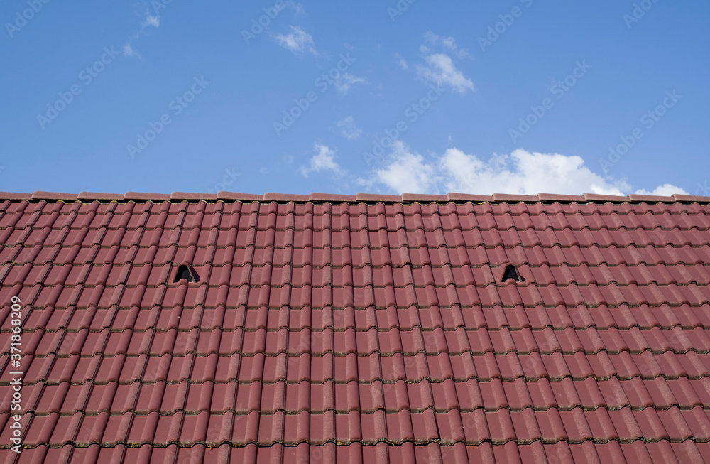 New tiled roof with louvered roof vent in the sky New tiled roof with louvered roof vent in the sky