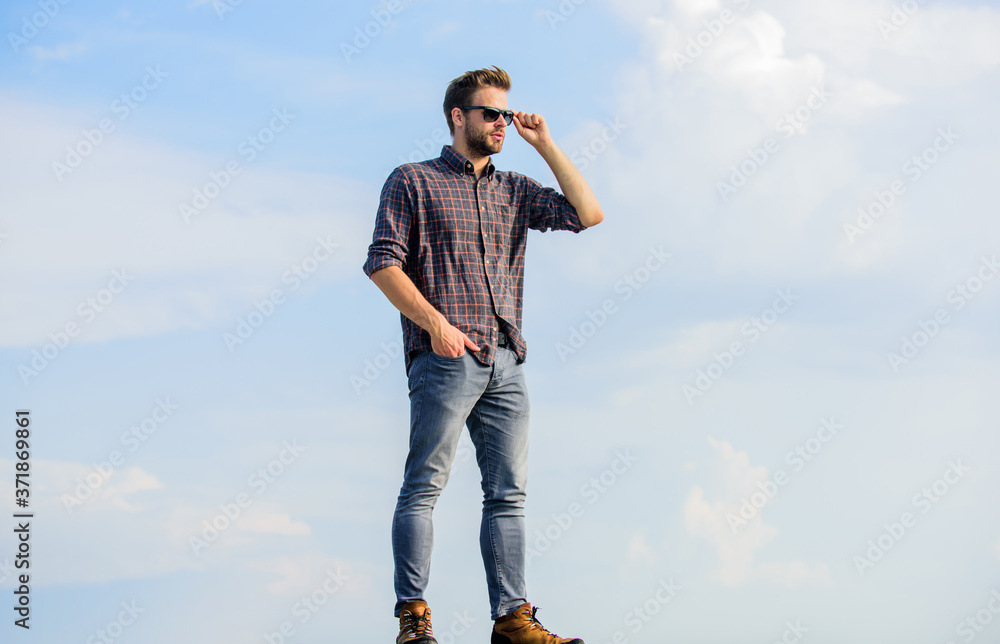 Handsome fashion model. businessman in glasses. confidence and charisma. macho man unshaven face. sexy man sky background. men beauty and sexuality. Real men. male fashion style. looking very trendy Handsome fashion model. businessman in glasses. confidence and charisma. macho man unshaven face. sexy man sky background. men beauty and sexuality. Real men. male fashion style. looking very trendy