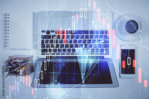 Stock market chart and top view computer on the table background. Multi exposure. Concept of financial analysis.