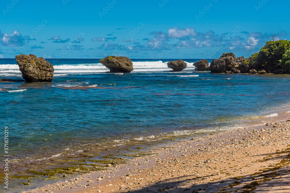 A view towards a line of wave-cut boulders offshore from Bathsheba Beach on the Atlantic coast of Barbados