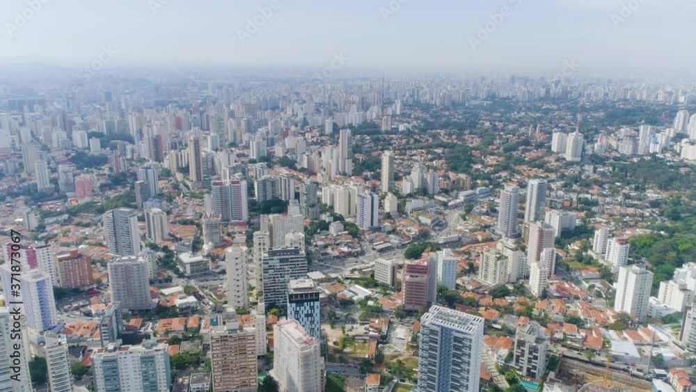 aerial view tracking above the buildings of Sao Paulo shot in 4K. Sao Paulo. Brazil.
aerial view tracking above the buildings of Sao Paulo shot in 4K. Sao Paulo. Brazil.