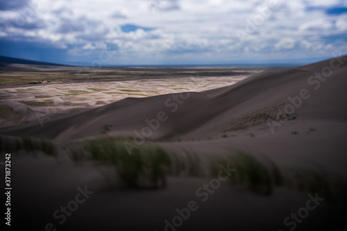 Sand dunes landscape using a tilt-shift lens giving miniature effect