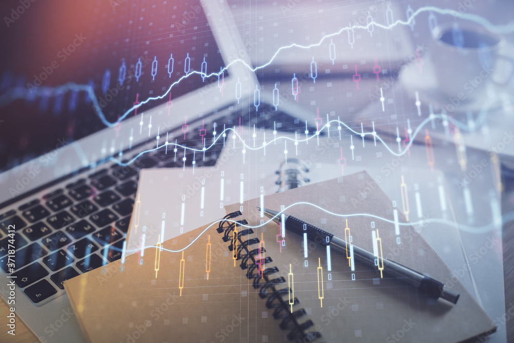 Double exposure of financial chart drawing and desktop with coffee and items on table background. Concept of forex market trading Double exposure of financial chart drawing and desktop with coffee and items on table background. Concept of forex market trading