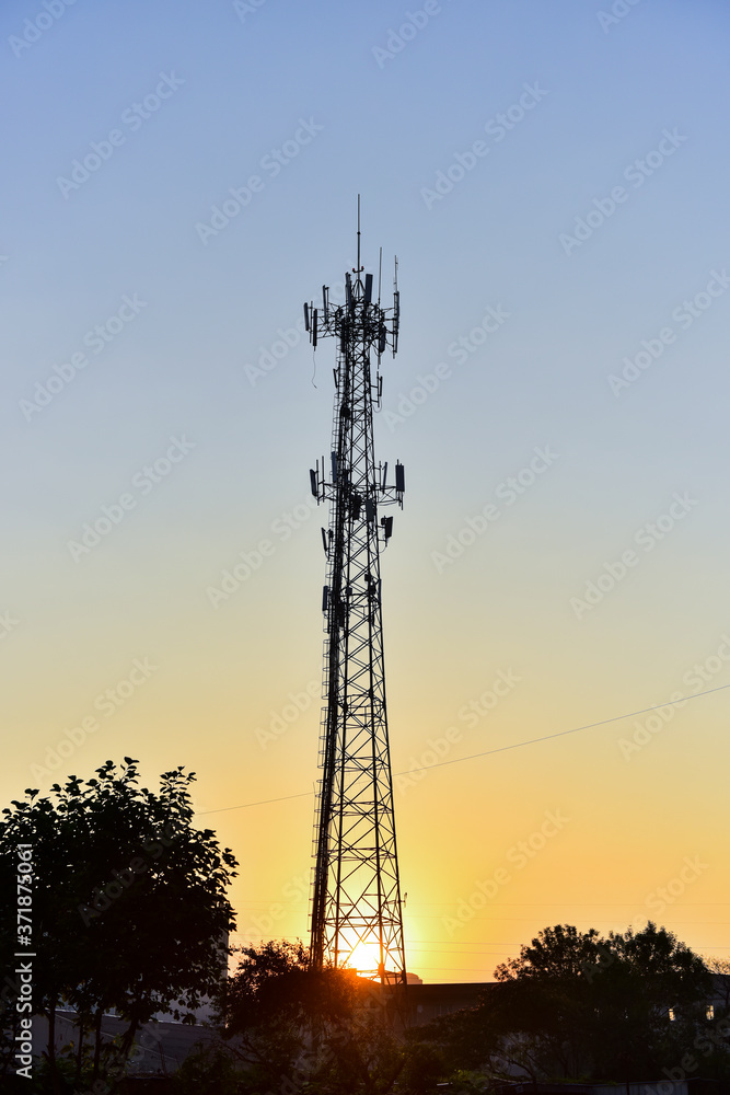 Wireless communication tower under the background of early morning sunrise Wireless communication tower under the background of early morning sunrise
