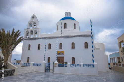 Panagia Platsani church in the picturesque village of Oia, Santorini, Greece (greek reads "Sacred Temple All Holy of the Akathist Hymn")