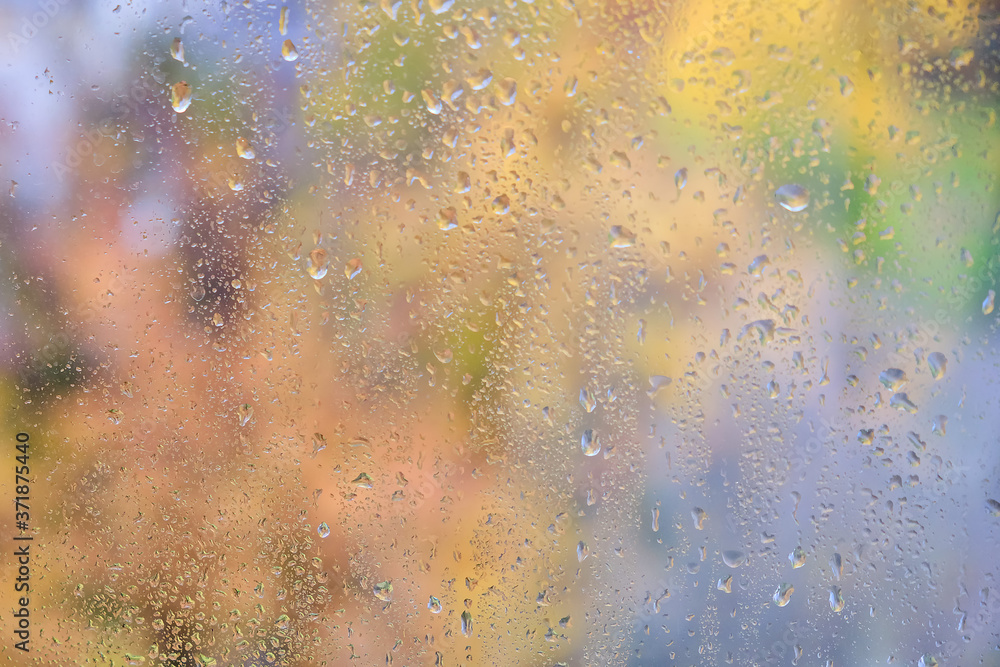 Blurred background with raindrops on the window glass