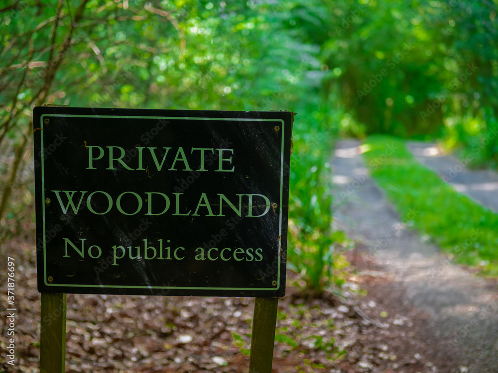 Private woodland sign in the woods 