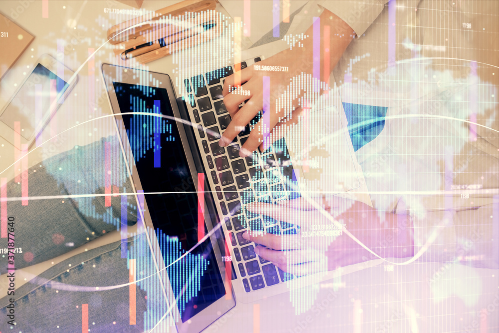 Double exposure of woman hands working on computer and financial theme hologram drawing. Top View. Business concept. Double exposure of woman hands working on computer and financial theme hologram drawing. Top View. Business concept.