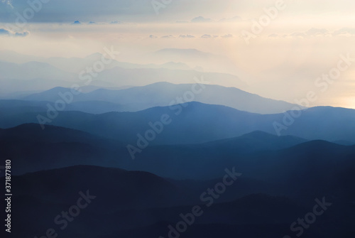 A chain of distant blue hills at dawn © Dmitriy D