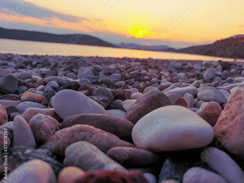 The sunset above the pebbles