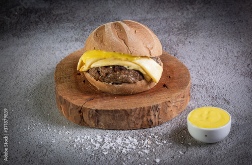 Craft beef burger with australian bread, cheese and honey mustard sauce. photo