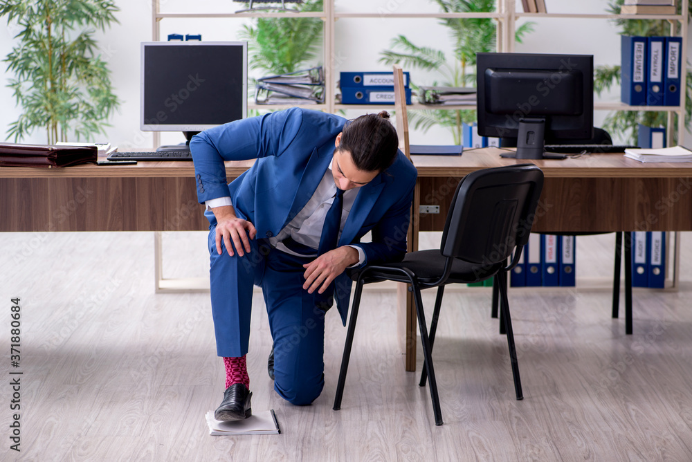 Young male employee businessman at workplace Young male employee businessman at workplace
