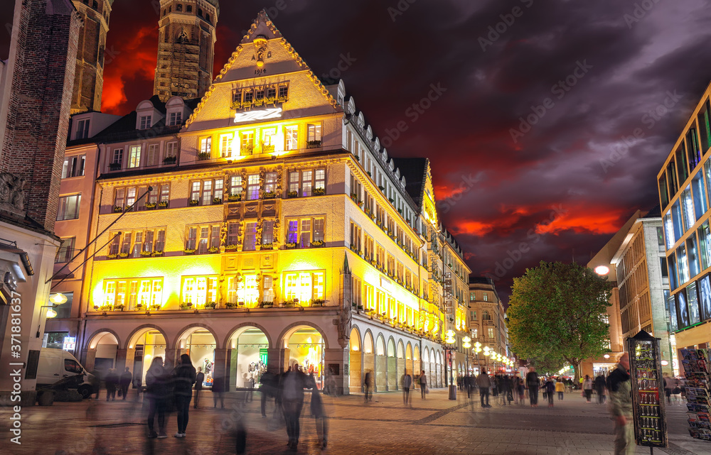 Exterior view of Hirmer, the largest men's fashion house in the world during nigh