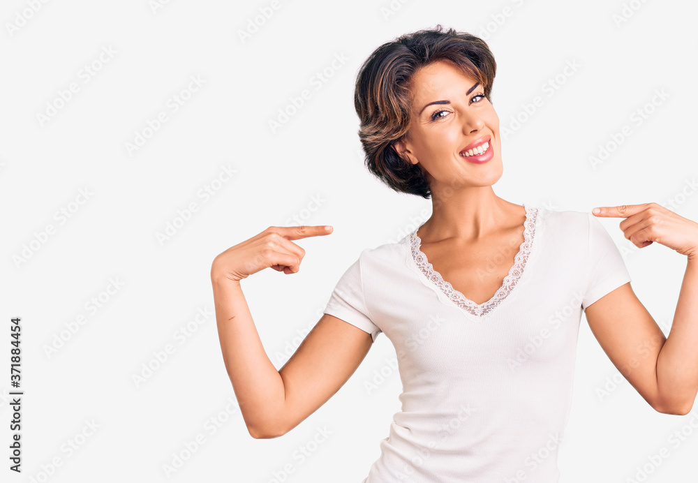 Young beautiful woman wearing casual clothes looking confident with smile on face, pointing oneself with fingers proud and happy. Young beautiful woman wearing casual clothes looking confident with smile on face, pointing oneself with fingers proud and happy.