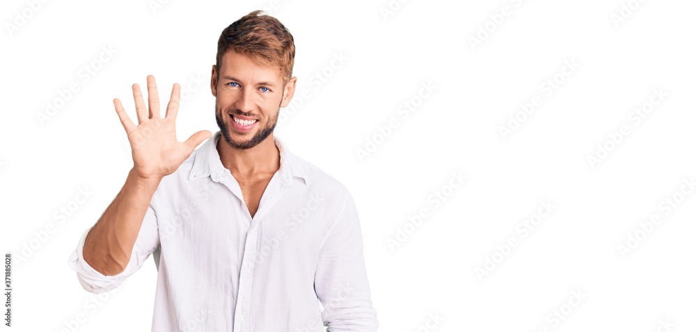 Young caucasian man wearing casual clothes showing and pointing up with fingers number five while smiling confident and happy.