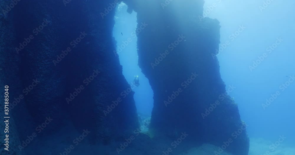 custom made wallpaper toronto digitalscuba divers exploring and swimming around an arch underwater cave and tunnel swim trough ocean scenery