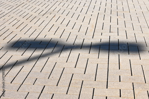 Shadow of Light on Sidewalk