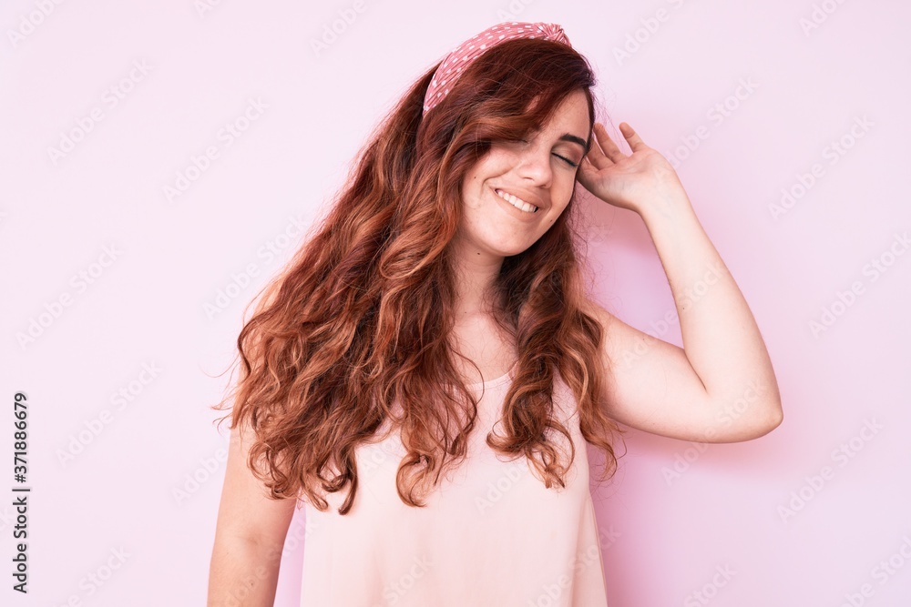 Young beautiful woman wearing casual clothes stretching back, tired and relaxed, sleepy and yawning for early morning Young beautiful woman wearing casual clothes stretching back, tired and relaxed, sleepy and yawning for early morning