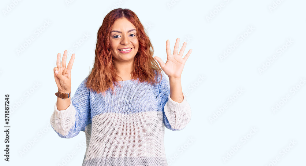 Young latin woman wearing casual clothes showing and pointing up with fingers number eight while smiling confident and happy. Young latin woman wearing casual clothes showing and pointing up with fingers number eight while smiling confident and happy.