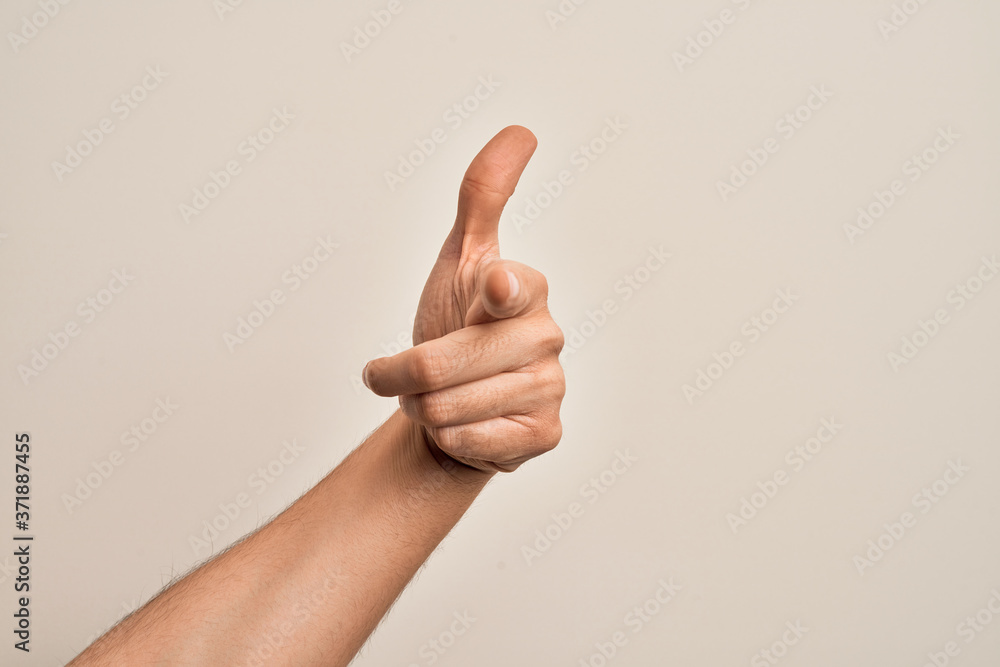 Hand of caucasian young man showing fingers over isolated white background pointing forefinger to the camera, choosing and indicating towards direction