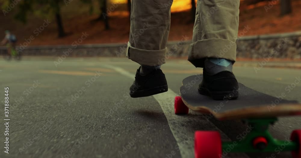 The guy is riding a skateboard. Bottom view close-up. The guy is riding a skateboard. Bottom view close-up.
