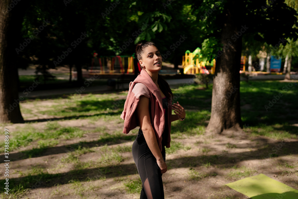 Young woman is resting after jogging in the park. Young woman is resting after jogging in the park.