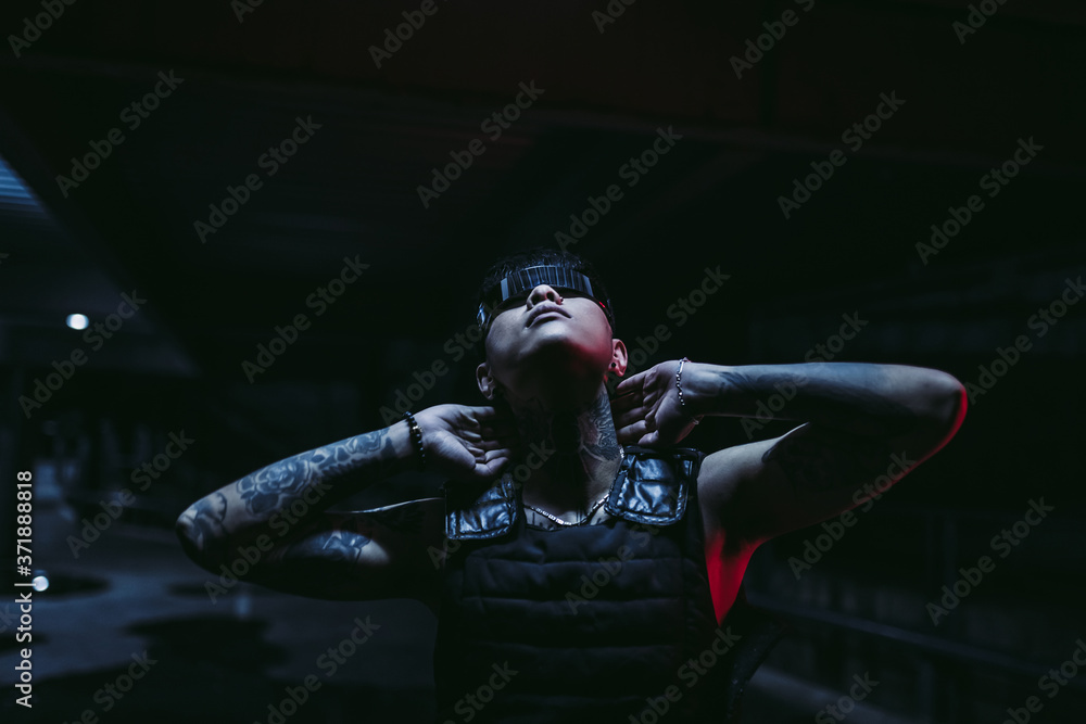 A man in special glasses looks at the light. The concept of the future. A man in special glasses looks at the light. The concept of the future.
