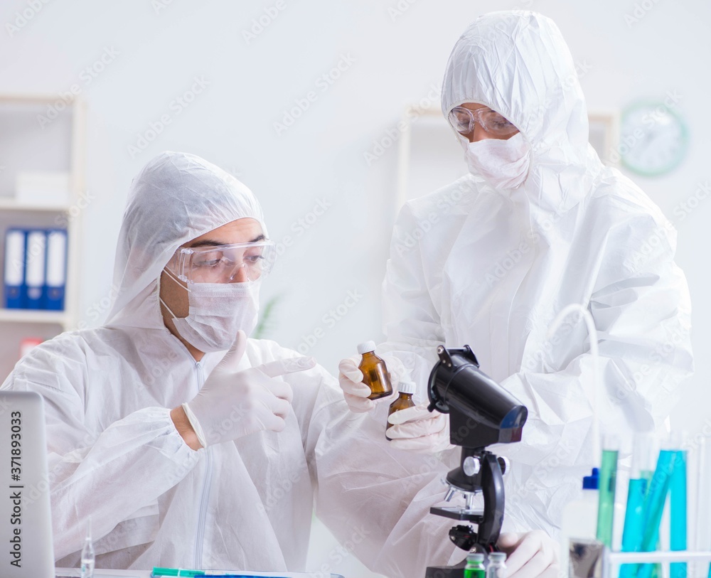 Two scientists working in the chemical lab