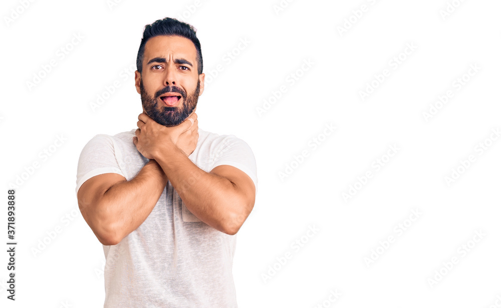 Young hispanic man wearing casual clothes shouting and suffocate because painful strangle. health problem. asphyxiate and suicide concept. Young hispanic man wearing casual clothes shouting and suffocate because painful strangle. health problem. asphyxiate and suicide concept.
