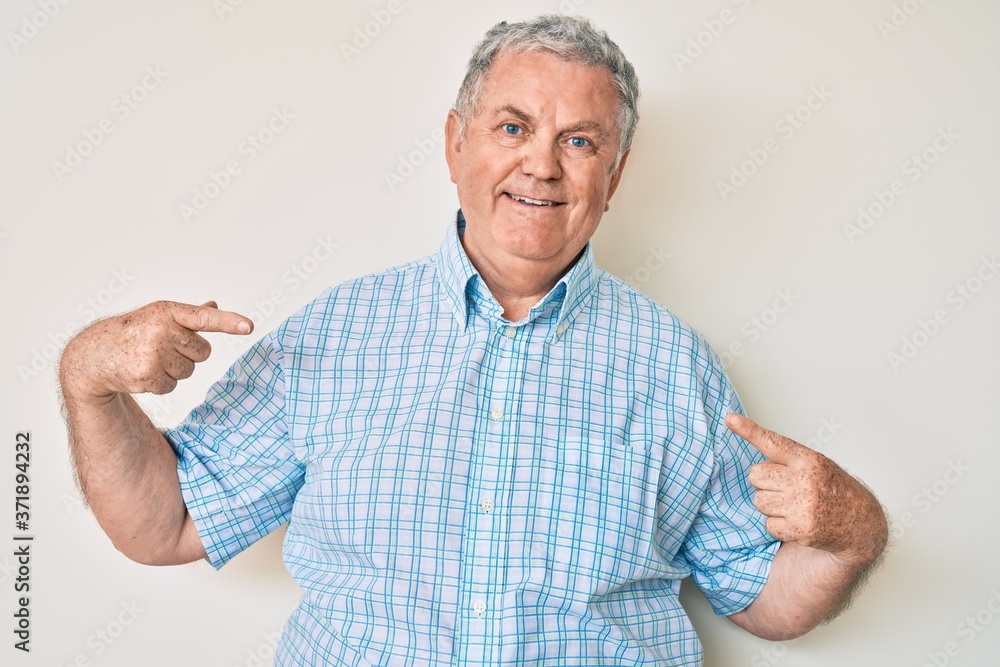 Senior grey-haired man wearing casual clothes looking confident with smile on face, pointing oneself with fingers proud and happy. Senior grey-haired man wearing casual clothes looking confident with smile on face, pointing oneself with fingers proud and happy.