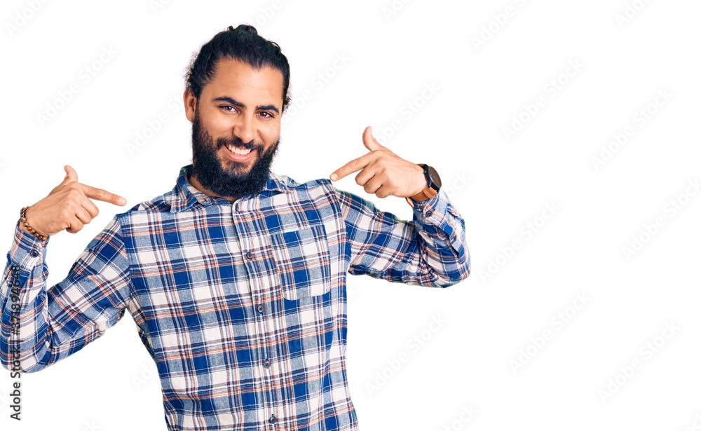 Young arab man wearing casual clothes looking confident with smile on face, pointing oneself with fingers proud and happy. Young arab man wearing casual clothes looking confident with smile on face, pointing oneself with fingers proud and happy.