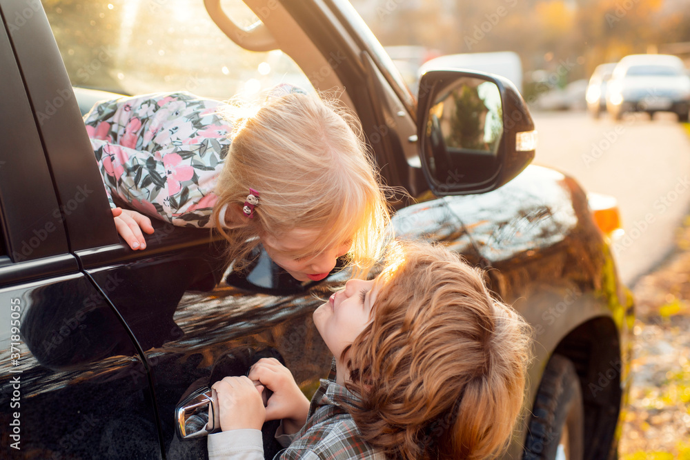Kids goodbye concept. Couple of kids loving each other hugging and kissing. Kids goodbye concept. Couple of kids loving each other hugging and kissing.