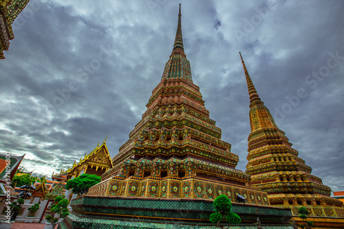 background of important religious attractions in Bangkok  Wat Phra Chetuphon  Wat Pho - reclining Buddha   a large pagoda and beautiful sculptural art give future generations to explore its history