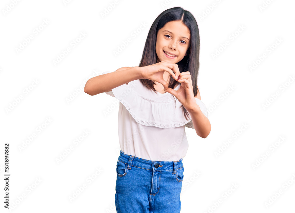 Beautiful child girl wearing casual clothes smiling in love doing heart symbol shape with hands. romantic concept. Beautiful child girl wearing casual clothes smiling in love doing heart symbol shape with hands. romantic concept.
