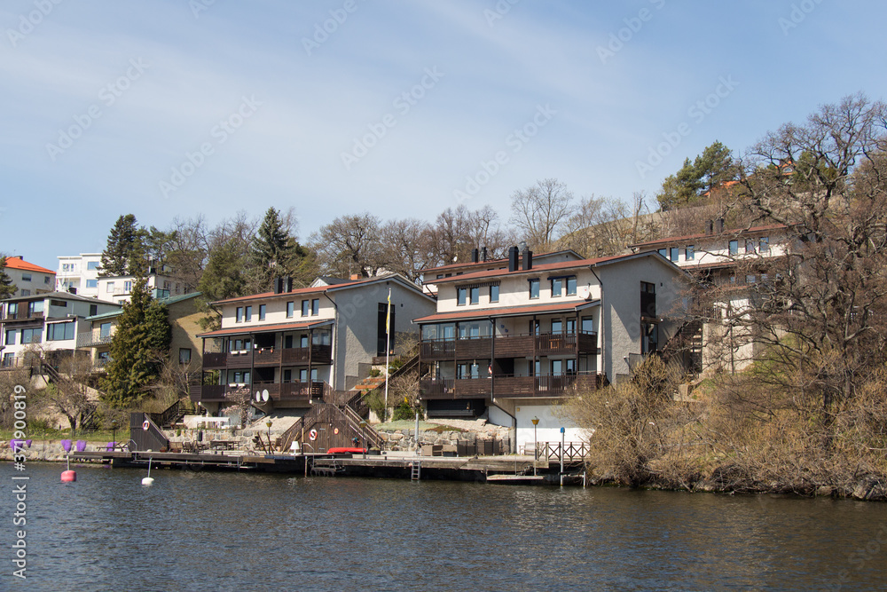 Fototapeta premium Typical buildings at Stockholm waterfront in a sunny day, Sweden.