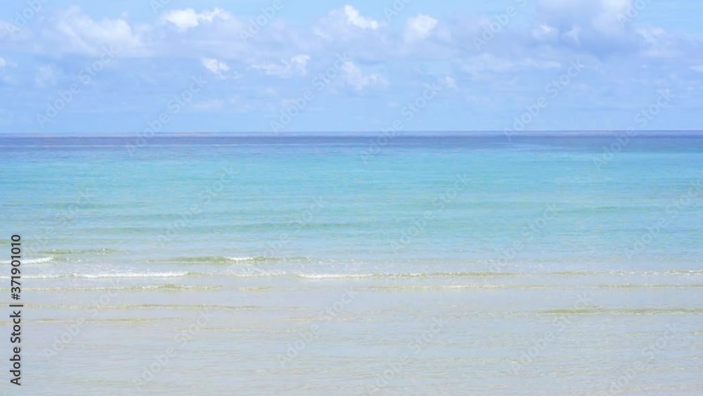 The blue sea, gentle waves and the white beach look so comfortable The blue sea, gentle waves and the white beach look so comfortable
