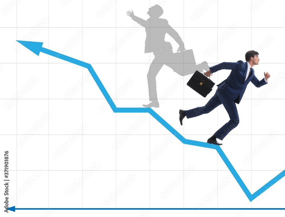 Businessman and his shadow in business concept Businessman and his shadow in business concept