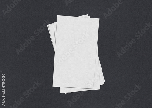 Blank white Business card mockup stacks on grey textured paper background.